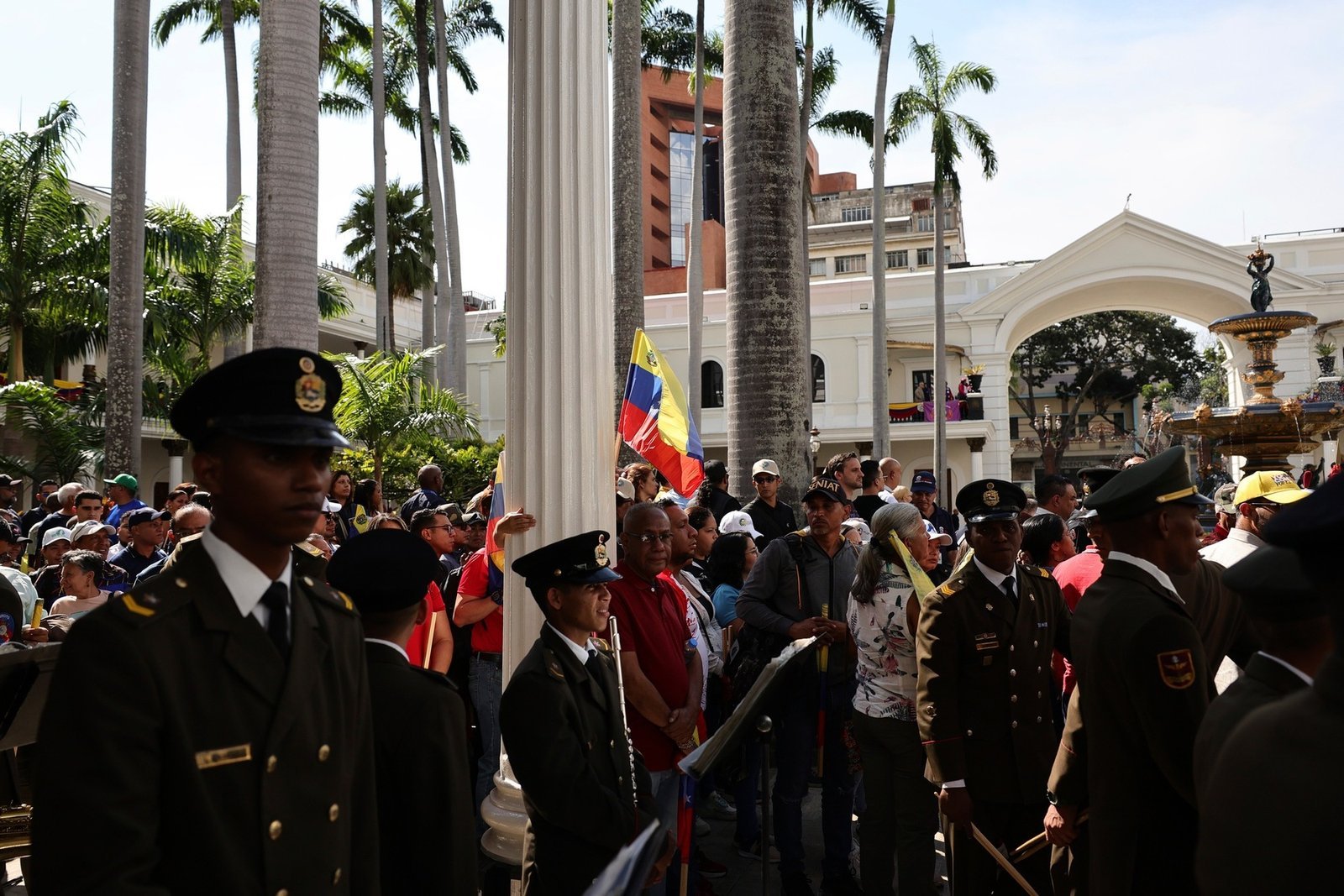 CARACAS, VENEZUELA – JANUARY 05: Venezuelans gather outside the Palacio Federal during the inaugural session for the 2026-2031 Legislative Constitutional Period at Palacio Federal Legislativo on January 05, 2026 in Caracas, Venezuela. Two days after Nicolas Maduro and his wife, Cilia Flores, were captured in Caracas by the US forces the National Assembly confirmed Vice President Delcy Rodriguez as Acting President. (Photo by Jesus Vargas/Getty Images)